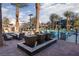 Two modern fountains in a brick paved area near the pool at 11327 Gravitation Dr, Las Vegas, NV 89135