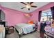 Pink bedroom with a double bed, ceiling fan, and window at 1205 Sattes St, Las Vegas, NV 89101