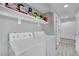 Laundry room with washer, dryer, and overhead shelving at 1205 Sattes St, Las Vegas, NV 89101