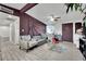 Bright living room with hardwood floors, purple accent wall and open floor plan at 1205 Sattes St, Las Vegas, NV 89101