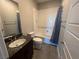 Clean bathroom with shower/tub combo and dark vanity at 12422 Tudor Arch Dr, Las Vegas, NV 89138