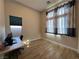 Bright home office with a desk and large window at 12422 Tudor Arch Dr, Las Vegas, NV 89138