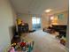 Spacious playroom with plush carpet, sliding glass doors, and ample natural light at 12422 Tudor Arch Dr, Las Vegas, NV 89138