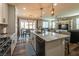 Modern kitchen with island, stainless steel appliances, and ample counter space at 126 Ostinato Ln, Henderson, NV 89015