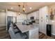 Sleek kitchen featuring white cabinets, gray countertops, and a breakfast bar at 126 Ostinato Ln, Henderson, NV 89015