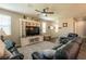 Living room with hardwood floors, a large TV, and comfortable seating at 126 Ostinato Ln, Henderson, NV 89015