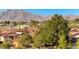 Aerial view of homes, mountain views, and lush greenery at 1426 Radig Ct, Boulder City, NV 89005