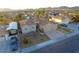 Aerial view of a house with a landscaped yard and two-car garage at 1426 Radig Ct, Boulder City, NV 89005