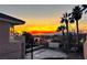 Sunset view from backyard with pool and basketball court at 1426 Radig Ct, Boulder City, NV 89005