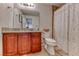 Bathroom with granite countertop, wood cabinets, and shower/tub combo at 1426 Radig Ct, Boulder City, NV 89005