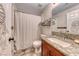 Clean bathroom with shower/tub combo and granite vanity at 1426 Radig Ct, Boulder City, NV 89005