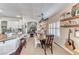 Bright dining area features a farmhouse table and chairs, and a view into the kitchen at 1426 Radig Ct, Boulder City, NV 89005