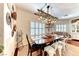 Farmhouse style dining room with wooden table and white chairs at 1426 Radig Ct, Boulder City, NV 89005