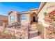 House with a courtyard and wrought iron gates at 1426 Radig Ct, Boulder City, NV 89005