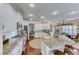 Spacious kitchen with granite island, white cabinets and hardwood floors at 1426 Radig Ct, Boulder City, NV 89005