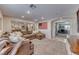 Spacious living room featuring a sectional sofa and adjacent home office at 1426 Radig Ct, Boulder City, NV 89005