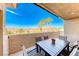 Covered patio with table and chairs, offering mountain views at 1426 Radig Ct, Boulder City, NV 89005