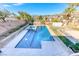 Inviting swimming pool and spa with a waterfall feature at 1426 Radig Ct, Boulder City, NV 89005