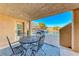 Relaxing pool area with patio furniture, under covered patio at 1426 Radig Ct, Boulder City, NV 89005