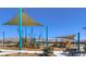 Modern playground with shade structure and mountain views at 1598 Dom River Dr # Lot 137, North Las Vegas, NV 89084