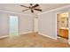 Primary bedroom with carpet flooring and ensuite bathroom at 167 White Butte St, Henderson, NV 89012