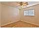 Well-lit bedroom featuring carpet and ceiling fan at 167 White Butte St, Henderson, NV 89012