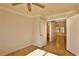 Bright bedroom with wood floors and ceiling fan at 167 White Butte St, Henderson, NV 89012