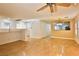 Bright living room with hardwood floors and a view into the kitchen at 167 White Butte St, Henderson, NV 89012