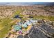 Aerial view of community clubhouse, pool, and tennis courts at 1848 Mountain Ranch Ave, Henderson, NV 89012