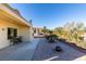 Spacious backyard with patio, fire pit, and desert landscaping at 1848 Mountain Ranch Ave, Henderson, NV 89012