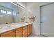 Clean bathroom with double sink vanity and a large mirror at 1848 Mountain Ranch Ave, Henderson, NV 89012