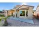 House exterior showcasing a patio and desert landscaping at 1848 Mountain Ranch Ave Dr, Henderson, NV 89012