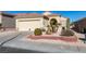 Single-story house with attached garage, landscaping, and desert plants at 1848 Mountain Ranch Ave Dr, Henderson, NV 89012