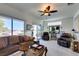 Bright living room with sliding glass doors leading to the patio at 1848 Mountain Ranch Ave Dr, Henderson, NV 89012