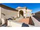 Covered patio with terracotta tile flooring and seating area at 1848 Mountain Ranch Ave Dr, Henderson, NV 89012