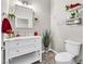 Modern bathroom with white vanity, toilet and shelving at 1992 Star Creek Bay Ln, Las Vegas, NV 89115