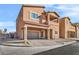 Two-story house with attached garage and front yard landscaping at 1992 Star Creek Bay Ln, Las Vegas, NV 89115