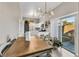 Modern kitchen with white cabinets, stainless steel appliances, and breakfast nook at 1992 Star Creek Bay Ln, Las Vegas, NV 89115