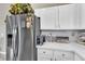 Stainless steel refrigerator in a bright kitchen with white cabinetry at 1992 Star Creek Bay Ln, Las Vegas, NV 89115