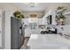 Modern kitchen with white cabinets and stainless steel appliances at 1992 Star Creek Bay Ln, Las Vegas, NV 89115