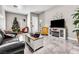 Bright living room featuring a Christmas tree and comfy seating at 1992 Star Creek Bay Ln, Las Vegas, NV 89115