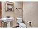 Simple bathroom with pedestal sink and updated fixtures at 2051 Saginaw Ave, Pahrump, NV 89048