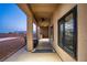 Covered patio with ceiling fan, seating area, and mountain view at 2051 Saginaw Ave, Pahrump, NV 89048