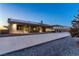 House exterior view showcasing a large backyard and solar panels at 2051 Saginaw Ave, Pahrump, NV 89048