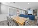 Elegant dining room with a rustic wood table and chevron patterned chairs at 2365 Boretto St, Henderson, NV 89044