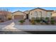 Single-story home with a two-car garage and landscaped front yard at 2365 Boretto St, Henderson, NV 89044