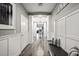 Tastefully decorated hallway with wainscoting, decorative accents, and a charming bench at 2365 Boretto St, Henderson, NV 89044