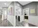 Hallway with wood floors, leading to bathroom and laundry at 2365 Boretto St, Henderson, NV 89044