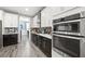 Bright kitchen with stainless steel appliances and dark wood cabinets at 2365 Boretto St, Henderson, NV 89044