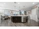 Modern kitchen island with seating and stainless steel dishwasher at 2365 Boretto St, Henderson, NV 89044